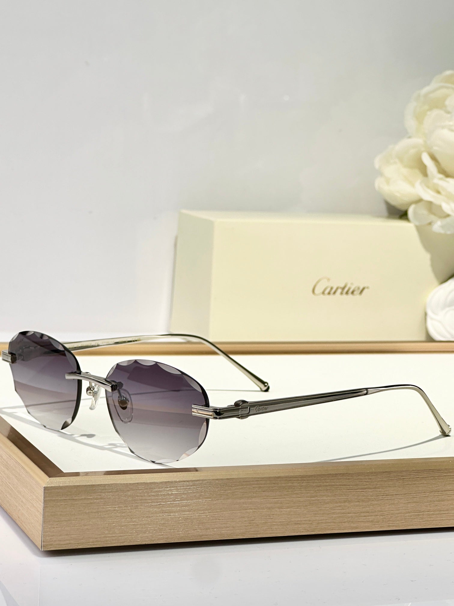 C DE RIMLESS ROUND FRAME SUNGLASSES CT0611S IN METAL