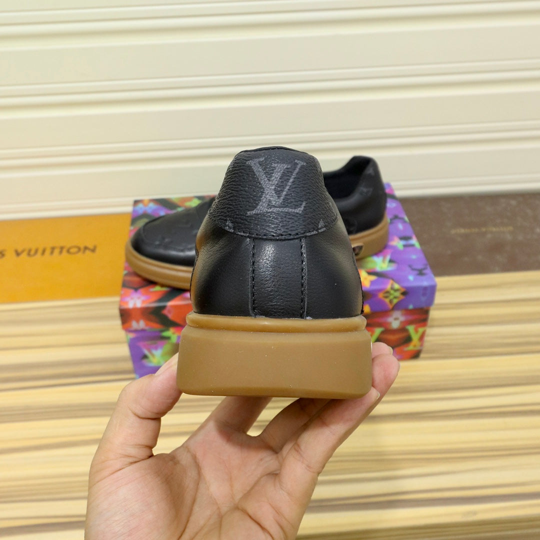 LV TRAINERS IN BLACK CALFSKIN AND BROWN RUBBER