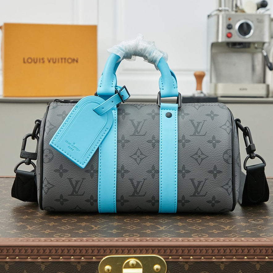 KEEPALL BANDOULIÈRE 25 IN GUN METAL MONOGRAM ECLIPSE CANVAS MIX TURQUOISE CALFSKIN