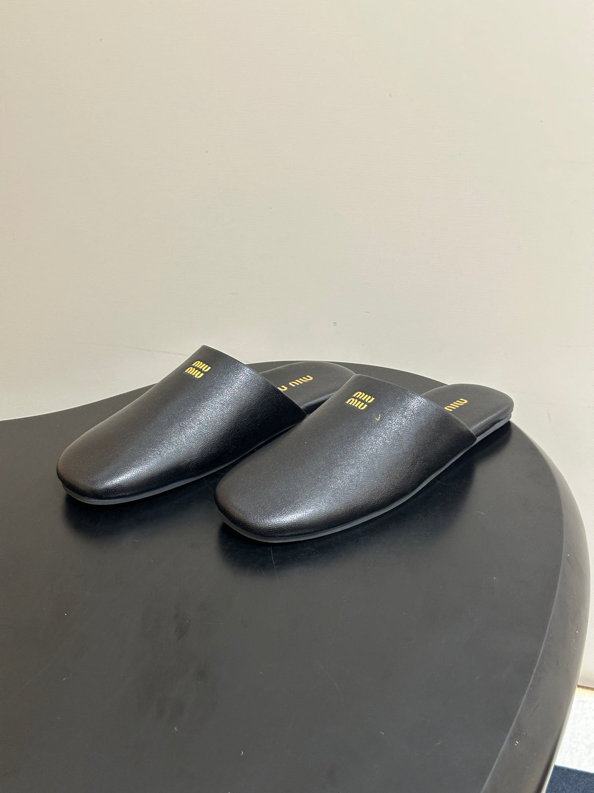 Miu Miu 2026 Flat Closed-Toe Mule Black Cowhide 994104